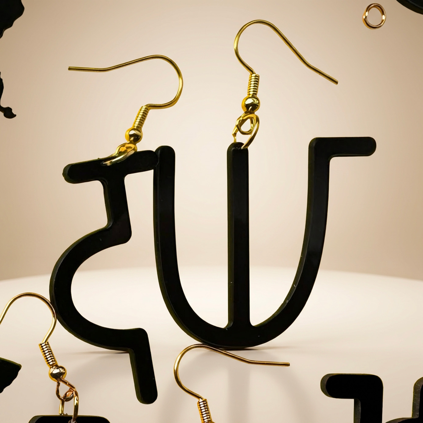 Afaka inspired laser cut jewelry in a clean square composition